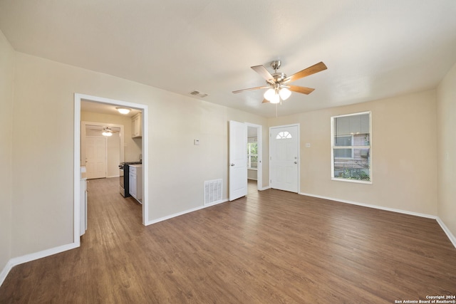 unfurnished room featuring dark hardwood / wood-style floors and ceiling fan