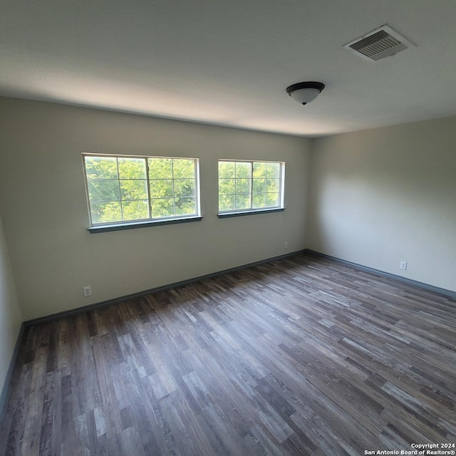 empty room featuring dark hardwood / wood-style floors