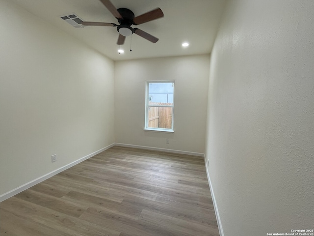 unfurnished room with light hardwood / wood-style floors and ceiling fan