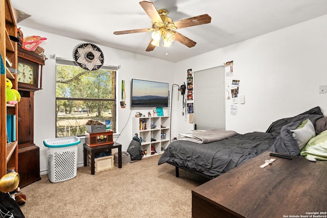 carpeted bedroom featuring ceiling fan