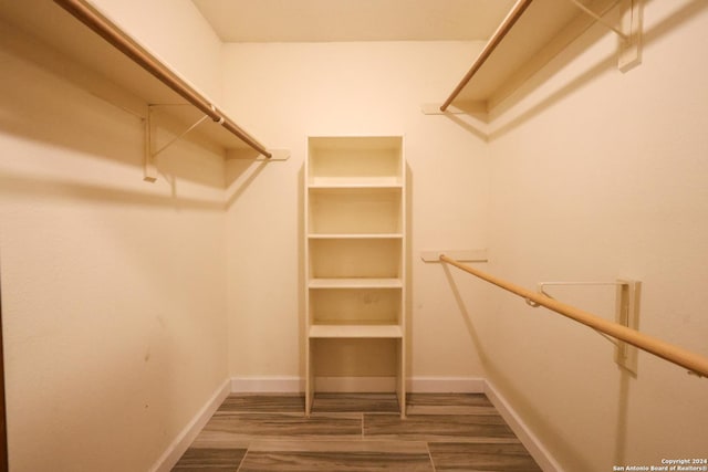 walk in closet featuring hardwood / wood-style floors