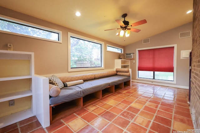 sitting room with ceiling fan, tile patterned flooring, a healthy amount of sunlight, and lofted ceiling