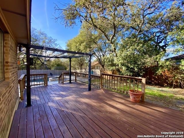 wooden deck with a pergola