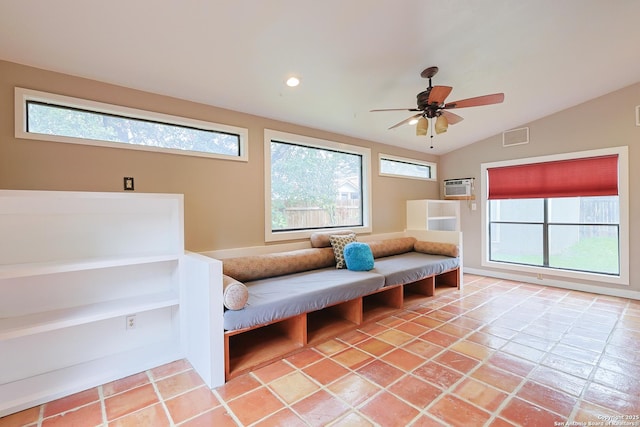 living area featuring a wealth of natural light, lofted ceiling, and ceiling fan