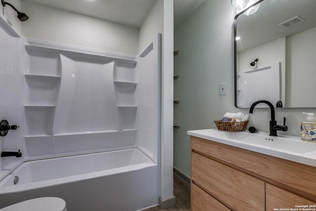 full bathroom with shower / tub combination, vanity, and toilet