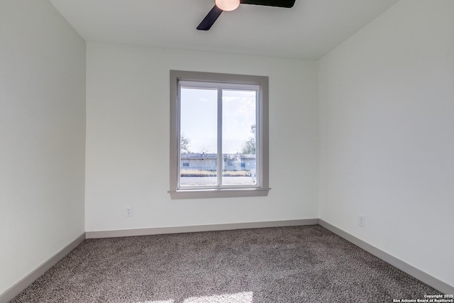 spare room featuring carpet flooring and ceiling fan