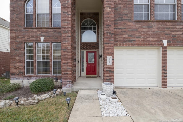 view of exterior entry with a garage