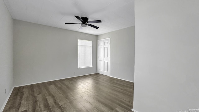 unfurnished room with ceiling fan and dark hardwood / wood-style floors