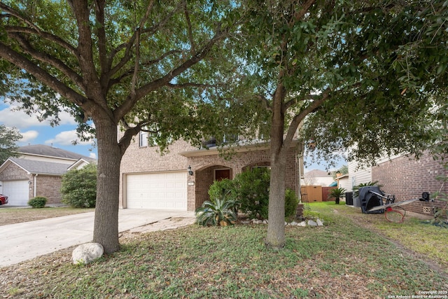 obstructed view of property with a garage