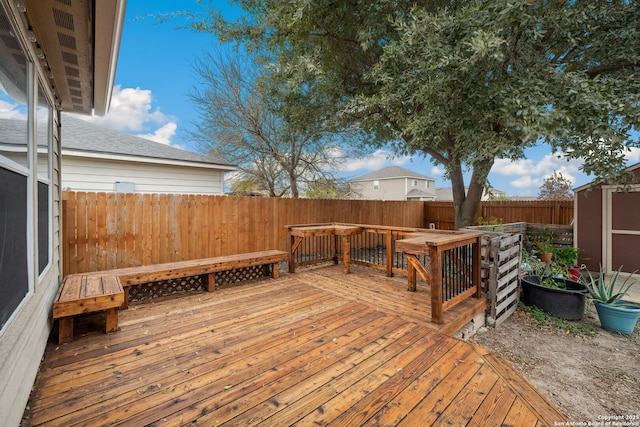 deck featuring a shed