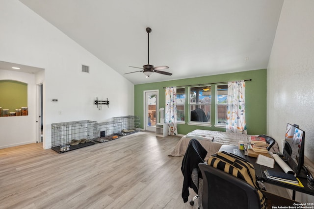 bedroom with ceiling fan, light hardwood / wood-style floors, and lofted ceiling