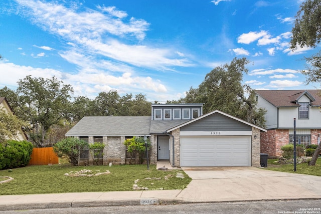 view of front property with a front yard and a garage