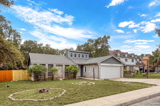 view of front facade featuring a garage and a front lawn