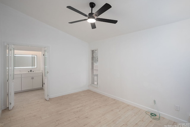 unfurnished room featuring ceiling fan, light wood-type flooring, and lofted ceiling