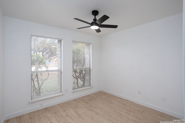 empty room featuring light hardwood / wood-style flooring and ceiling fan