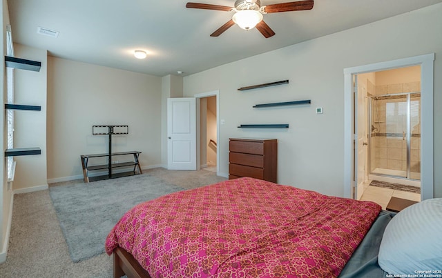 carpeted bedroom featuring ensuite bathroom and ceiling fan