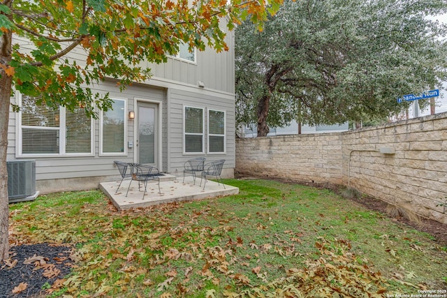 view of yard featuring a patio and central air condition unit