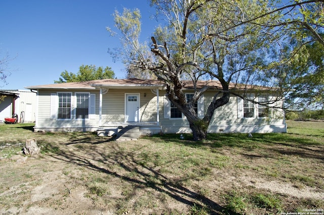 ranch-style house with a front lawn