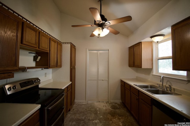 kitchen with ceiling fan, sink, appliances with stainless steel finishes, and vaulted ceiling