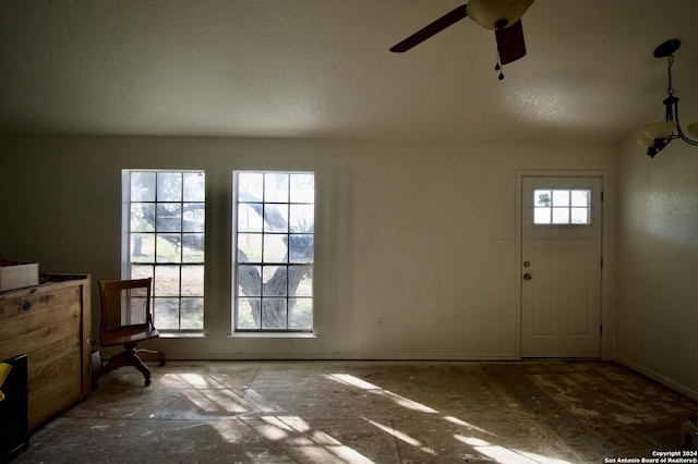 foyer entrance with ceiling fan