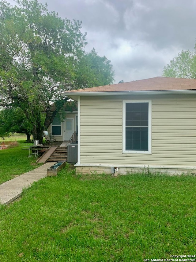 view of property exterior featuring a yard