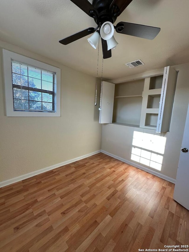 unfurnished bedroom featuring light hardwood / wood-style floors and ceiling fan