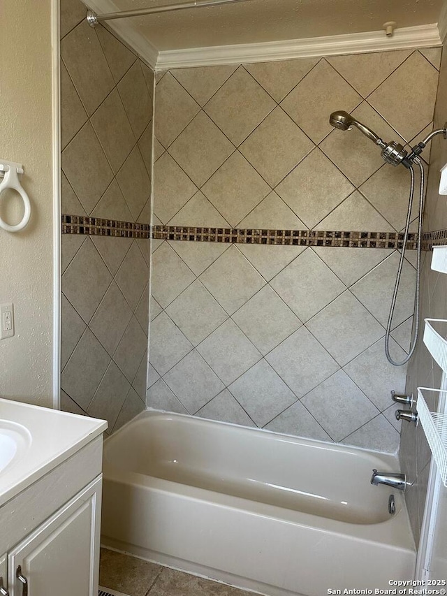 bathroom featuring vanity, tiled shower / bath combo, and ornamental molding