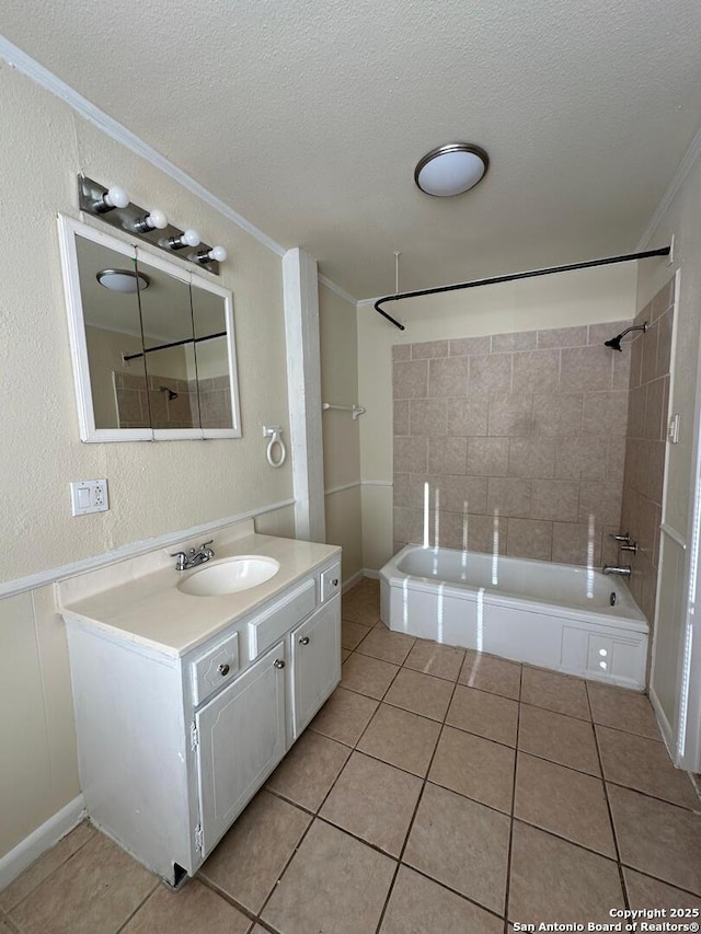 bathroom with tile patterned floors, crown molding, and a textured ceiling