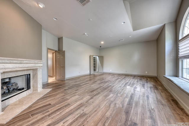 unfurnished living room with light wood-type flooring