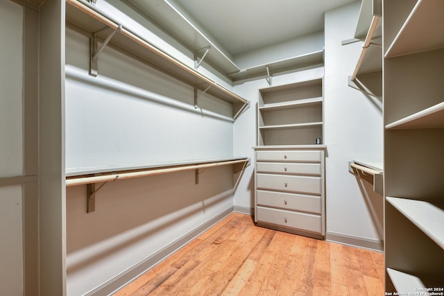 walk in closet featuring light hardwood / wood-style floors