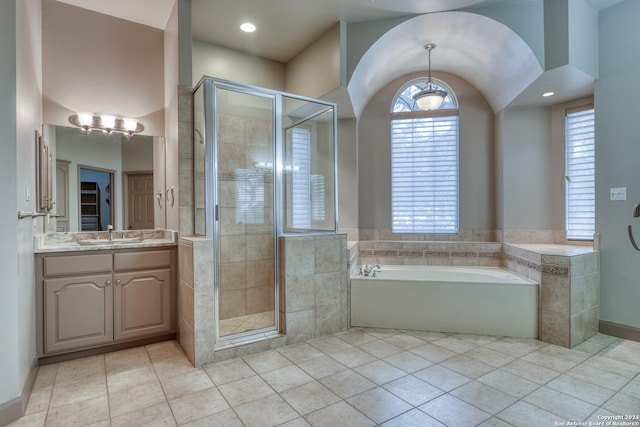 bathroom with vanity, tile patterned floors, and independent shower and bath