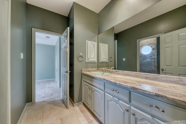 bathroom featuring tile patterned floors and vanity