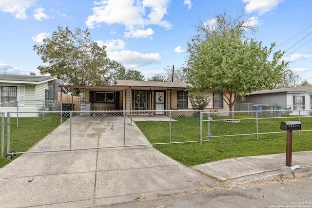 single story home with a front yard and a carport