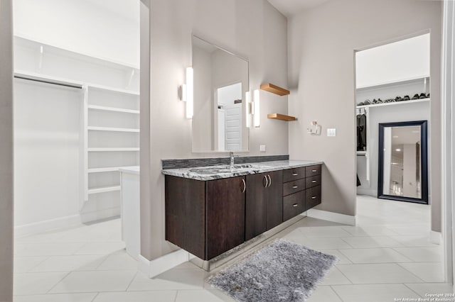 bathroom featuring tile patterned flooring and vanity