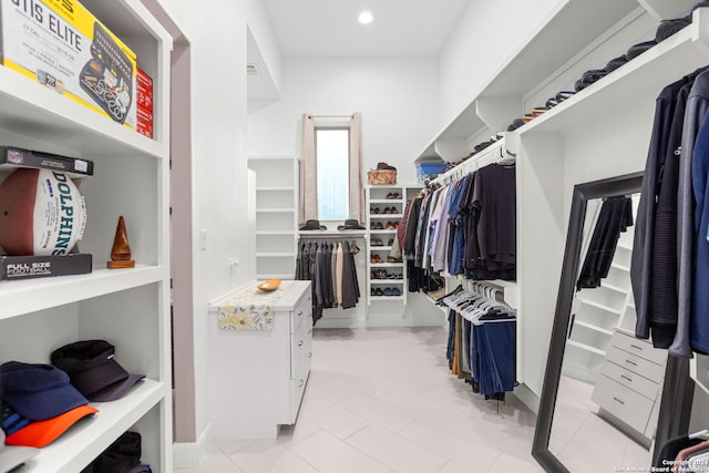 spacious closet with light tile patterned flooring