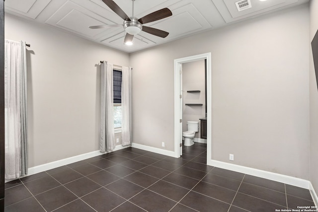 tiled empty room with ceiling fan