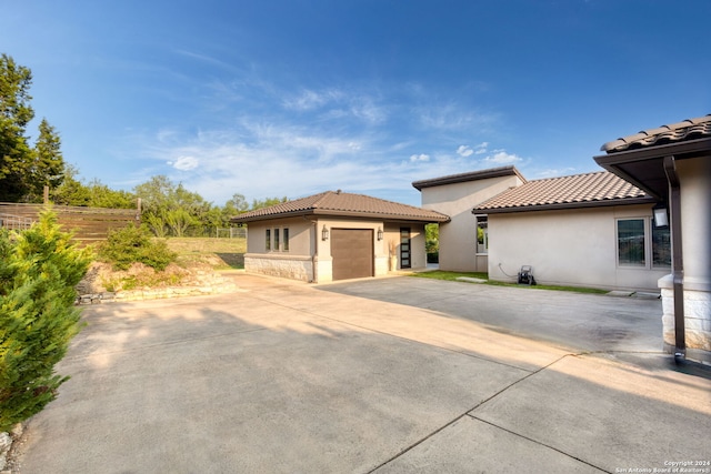 view of side of home featuring a garage