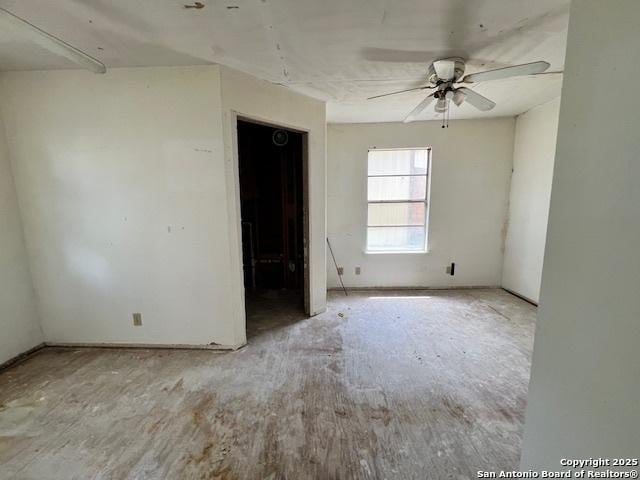 unfurnished room with ceiling fan