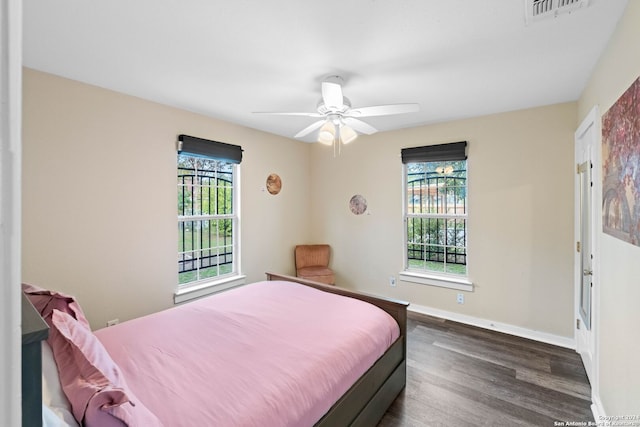 bedroom featuring dark hardwood / wood-style flooring and ceiling fan