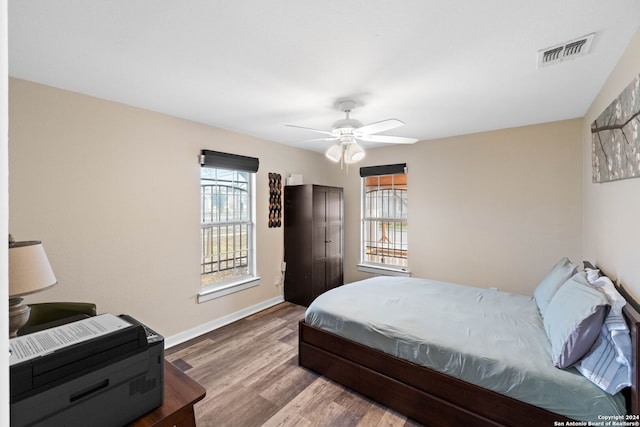 bedroom featuring ceiling fan and hardwood / wood-style flooring