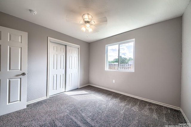 unfurnished bedroom with carpet flooring, a closet, and ceiling fan