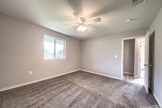 spare room with carpet and ceiling fan