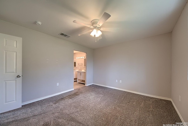 empty room with ceiling fan and carpet