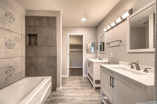 bathroom featuring hardwood / wood-style flooring and vanity