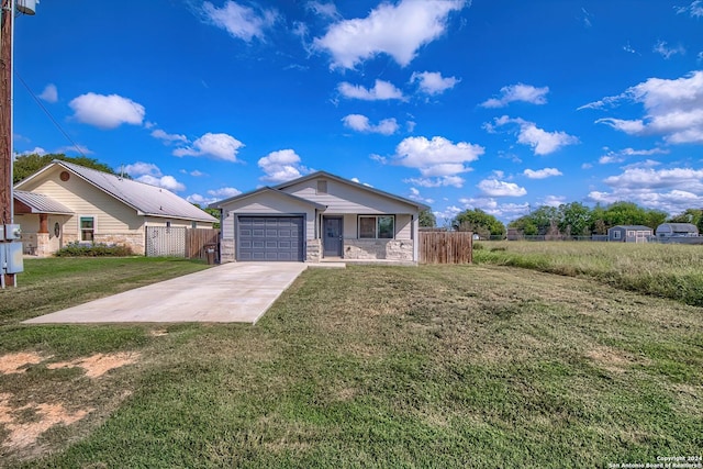 view of front of house with a front yard and a garage