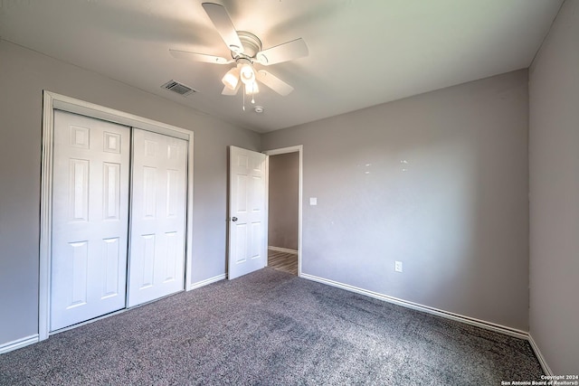 unfurnished bedroom with carpet, a closet, and ceiling fan