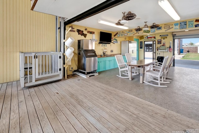 interior space with light wood-type flooring, ceiling fan, and sink