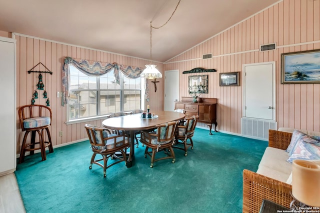 dining room featuring wooden walls, dark carpet, vaulted ceiling, and ornamental molding