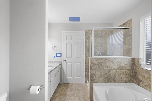 bathroom featuring shower with separate bathtub and vanity