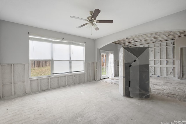 spare room featuring a wealth of natural light and ceiling fan